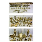 BRASSWARE - a large collection including horse brasses, candlesticks, vases, table lamp, door