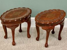 MODERN EASTERN MAHOGANY OVAL SIDE TABLES - a pair, the shaped edge tops with brass inlay and