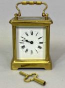 VINTAGE BRASS CARRIAGE CLOCK - with winding key having a white enamel dial set with Roman