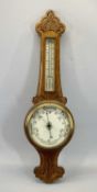 EDWARDIAN OAK ANEROID WALL BAROMETER WITH THERMOMETER - scroll carved decoration, 85cms H