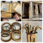 WALKING STICKS & UMBRELLAS, a collection contained in a wooden stick stand and a quantity of picture