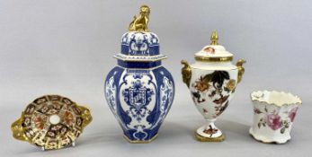 ROYAL CROWN DERBY LIDDED VASE of panelled hexagonal form, glazed in blue and white, the cover with