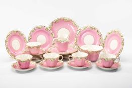 CROWN PINK DELPHINE CHINA TEA SERVICE FOR TWELVE, comprising milk jug, slops bowl, bread and