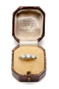 PLATINUM THREE STONE DIAMOND RING, engraved to shank ‘I. McW To M.E.G. 1-3-23’, tot diamond wt.
