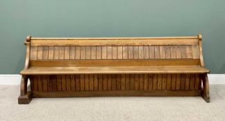 VICTORIAN OAK CHURCH PEW - pegged end supports, one end raised on a substantial canted block, the