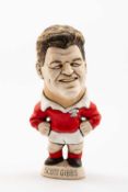 GROGG CARICATURE BY JOHN HUGHES (GROGG SHOP WALES) OF SCOTT GIBBS standing on titled base, wearing