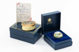 TWO HALCYON DAYS ENAMEL BOXES, comprising oval box with hinged cover, decorated with St Kew Barton