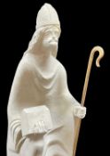 CARVED LIMESTONE SCULPTURE OF SAINT DYFRIG, 20th Century, holding a casket and wooden crozier 50cm