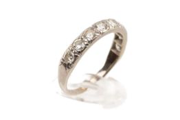 18CT WHITE GOLD NINE STONE DIAMOND RING, the nine stones measuring 0.7cts overall approx., ring size