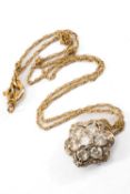 SEVEN STONE DIAMOND FLOWERHEAD PENDANT, the diamonds measuring 1.0cts overall approx., on 9k gold