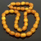 BUTTERSCOTCH AMBER BEAD NECKLACE & SIMILAR OVAL BEAD BRACELET - 69.1grms gross, 29 near uniform