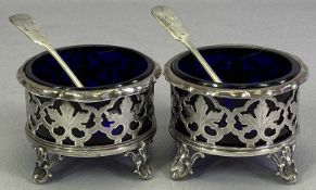 VICTORIAN SILVER TABLE SALTS, A PAIR - along with two non-matching spoons, Sheffield 1845, Henry