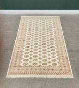 G H FRITH PAKISTAN BOKHARA CREAM GROUND RECTANGULAR WOOL RUG - central diamond and circular design
