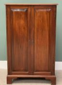 VICTORIAN MAHOGANY TWO DOOR STORAGE CUPBOARD - having chamfered panels to the doors, on corner