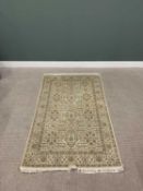 G H FRITH ORIENTAL RECTANGULAR WOOL RUG - central cream and beige repeating floral design with