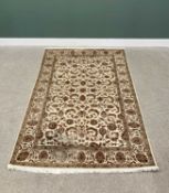 G H FRITH INDO PERSIAN CREAM GROUND RECTANGULAR WOOL RUG - central brown leaf and floral design with