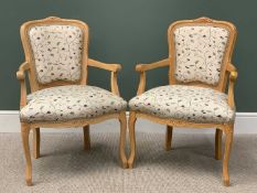 REPRODUCTION FLORAL UPHOLSTERED & LIGHT WOOD ARMCHAIRS - a pair, with attached 