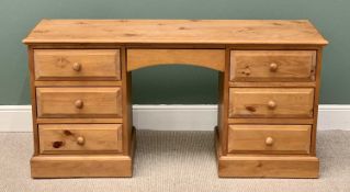 MODERN PINE PEDESTAL DESK / DRESSING TABLE having an arched central drawer, 77cms H, 151cms W, 44cms