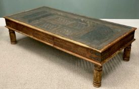 LARGE EASTERN-STYLE CARVED HARDWOOD COFFEE TABLE WITH GLASS TOP, the centre fashioned as a