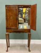 REPRODUCTION WALNUT TWO DOOR COCKTAIL CABINET, the interior mirrored, along with shaped glass