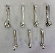 SHEFFIELD SILVER SUGAR TONGS - a collection of seven, all having individual bright cut and other
