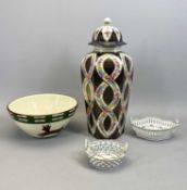 CONTINENTAL PORCELAIN LIDDED VASE - of panelled octagonal baluster form, decorated with inter twined