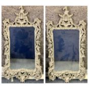 LARGE FANCY ORNATE WALL MIRRORS, A PAIR - in painted composition frames, 151 x 73cms