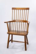 PRIMITIVE WELSH ELM & ASH COMB BACK CHAIR, 19th Century, nine-stick back, carved arms, bowed