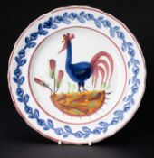 LLANELLY POTTERY COCKEREL PLATE circa 1900, continuous leaf and flower border in blue, the