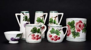 LLANELLY POTTERY GROUP comprising pair of cherry decorated tapered vases, 15cms high, similar with