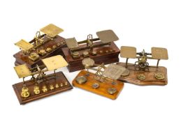 FIVE VARIOUS SETS BRASS POSTAL SCALES, comprising one set 8oz - 1/4oz, one set 8oz-1/2oz, with