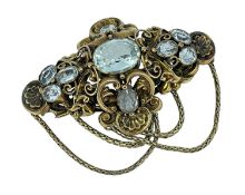 YELLOW METAL AQUAMARINE BAR BROOCH, of lozenge shape, scroll and shell design, set with nine