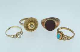 FOUR RINGS, comprising 9ct gold carnelian ring, 9ct gold three stone semi-precious white stone ring,