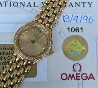 18CT GOLD OMEGA LADY'S WRISTWATCH, having diamond set dial and bezel, integrated 18ct gold brick