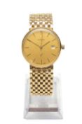 9CT GOLD MARVIN 'Q' GENT'S WRISTWATCH, the champagne dial with date aperture, baton hour markers,