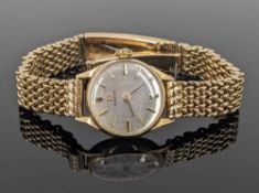 9CT GOLD LADY'S OMEGA WRISTWATCH, the silvered dial with baton markers, movement numbered