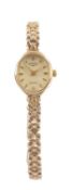 9CT GOLD LADY'S ROTARY WRISTWATCH, quartz, with oval dial, baton markers, and 9ct gold integrated