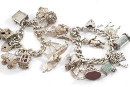 TWO SILVER CHARM BRACELETS, well filled with 9 charms each, tot appr wt. 6.3ozt (2)