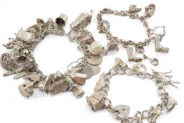 THREE SILVER CHARM BRACELETS, filled with 31, 8 & 9 charms each, tot appr wt. 4.9ozt (3)