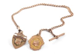 9CT GOLD ALBERT CHAIN, graduated curb links, T-bar, with two shield pendant fobs, 48.5cms long, 44.