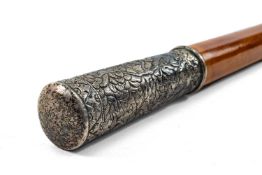 CHINESE WHITE METAL MOUNTED MALACCA CANE, handle embossed with flowers, brass ferrule, 92cms h