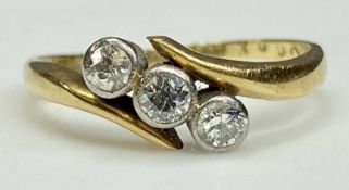 VINTAGE 18CT GOLD THREE-STONE DIAMOND RING the round cut stones individually set to closed mounts,
