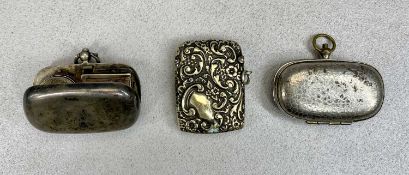 SILVER & WHITE METAL SOVEREIGN HOLDERS AND A BASE METAL VESTA CASE, the silver example oval format