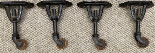 SET OF FOUR VONO TRADEMARK BED / FURNITURE HEIGHT BOOST CASTORS cast iron with turned wooden wheels,