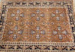 TWO EASTERN STYLE WOOLLEN RUGS, the first being hand knotted with central repeat pattern motif on