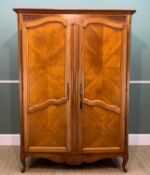 FRENCH PROVINCIAL CHESTNUT ARMOIRE, foliate carved spandrels, quarter veneered naelled doors,