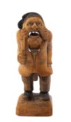 VINTAGE CARVED WOODEN NUTCRACKER in the form of Ebeneezer Scrooge, 15.5cms high Provenance: