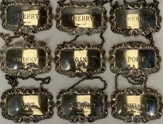 NINE SILVER DECANTER LABELS BEARING BIRMINGHAM HALLMARKS, port and gin, 1976, maker S J Rose &