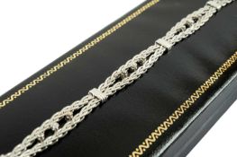 18CT WHITE GOLD BRACELET, accented with fifteen claw set diamonds, 20cms long, with integrated box