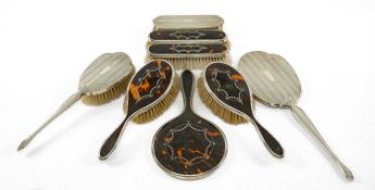 TWO PART DRESSING TABLE SETS comprising, silver backed hand brush, mirror and long brush with engine